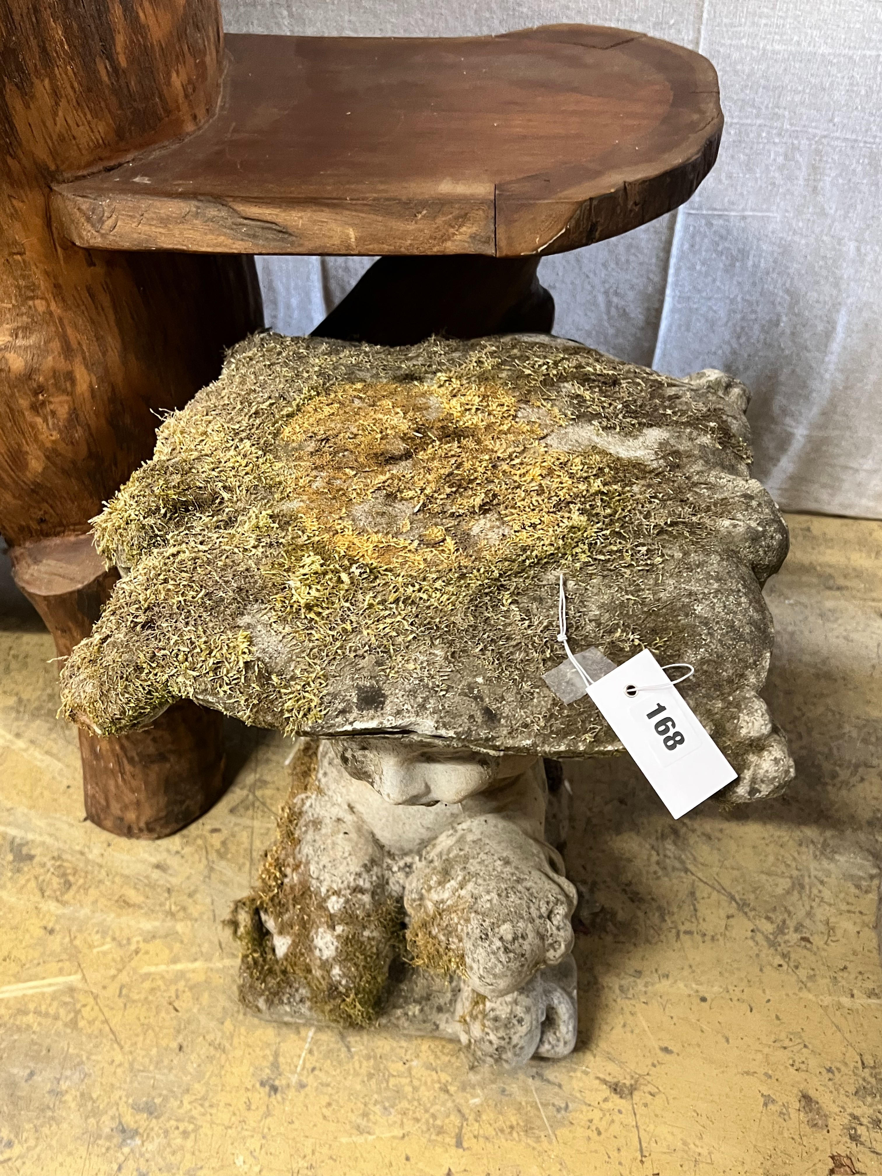 A reconstituted stone Faun garden seat, width 48cm height 46cm
